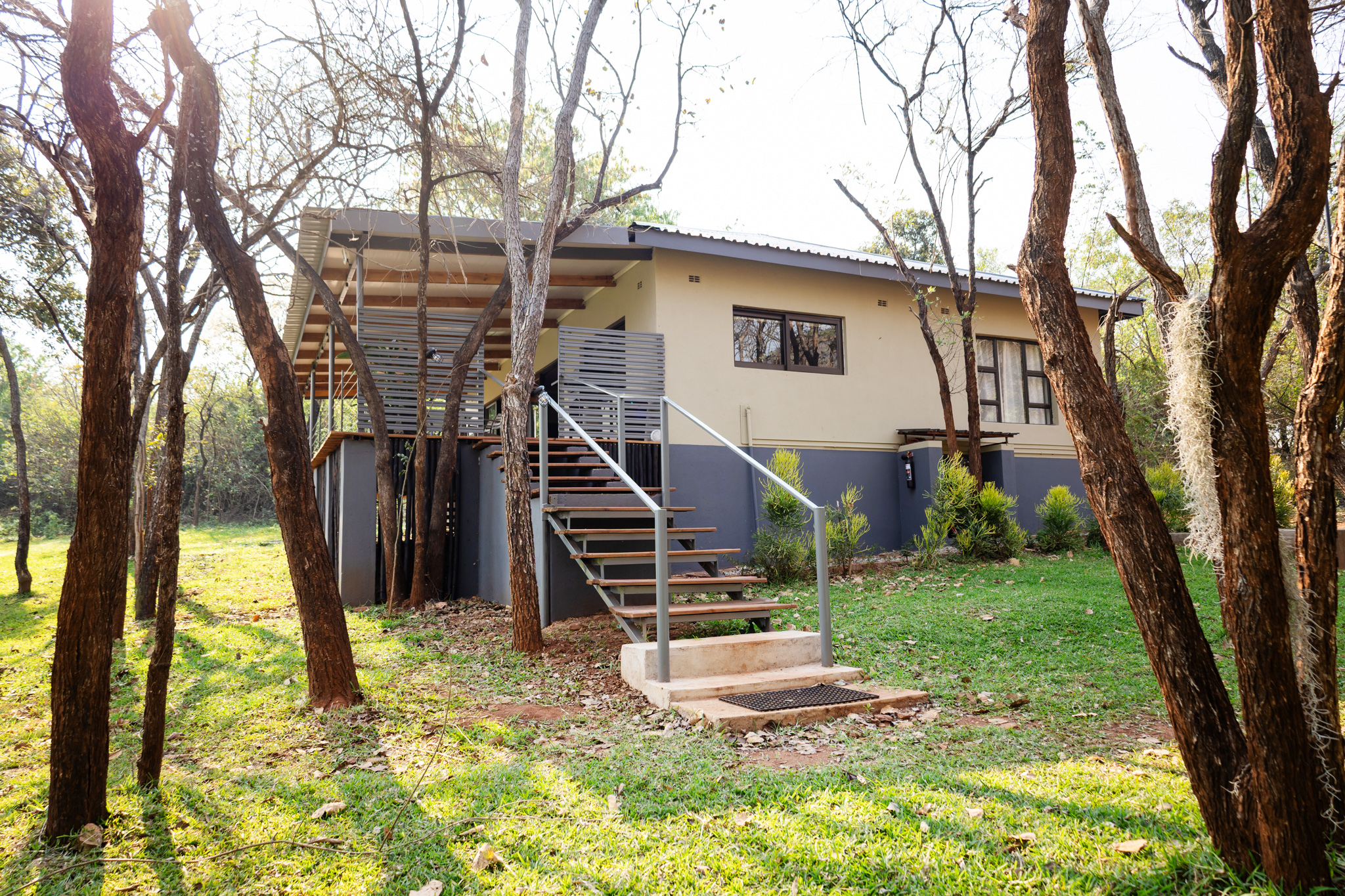 Entrance and deck steps at House 1
