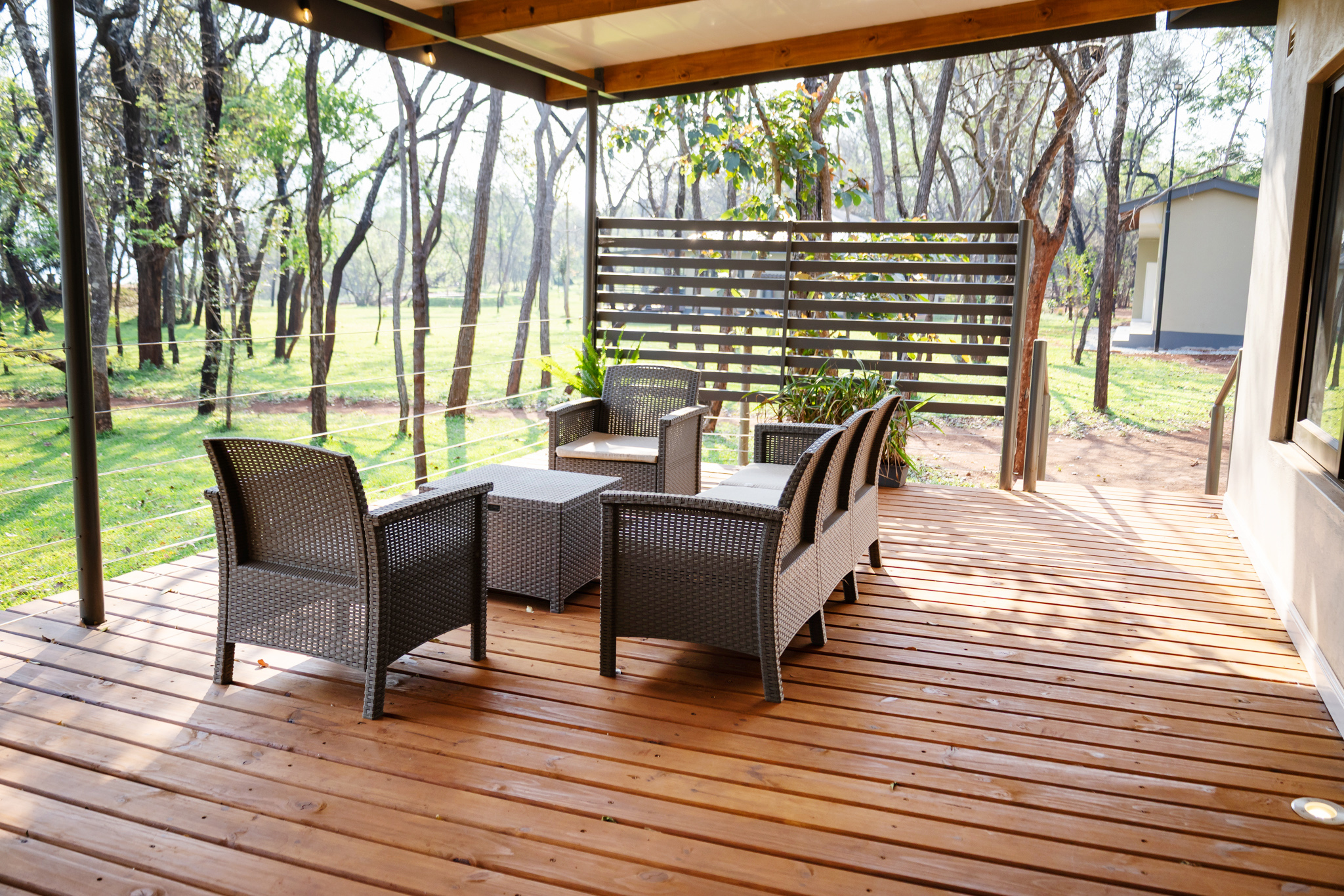 Covered deck lounge at a Woodlands residence